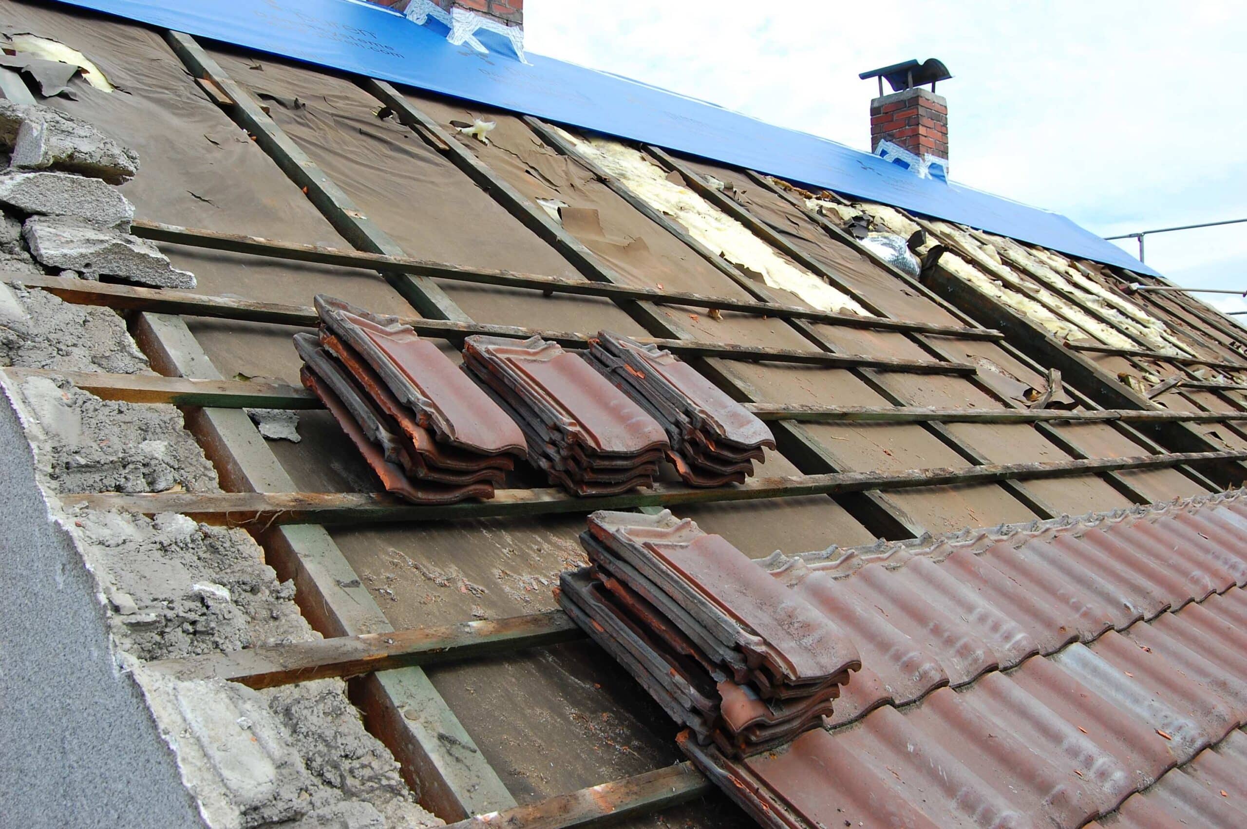 tiles-being-removed-from-a-roof-2024-04-01-11-38-01-utc