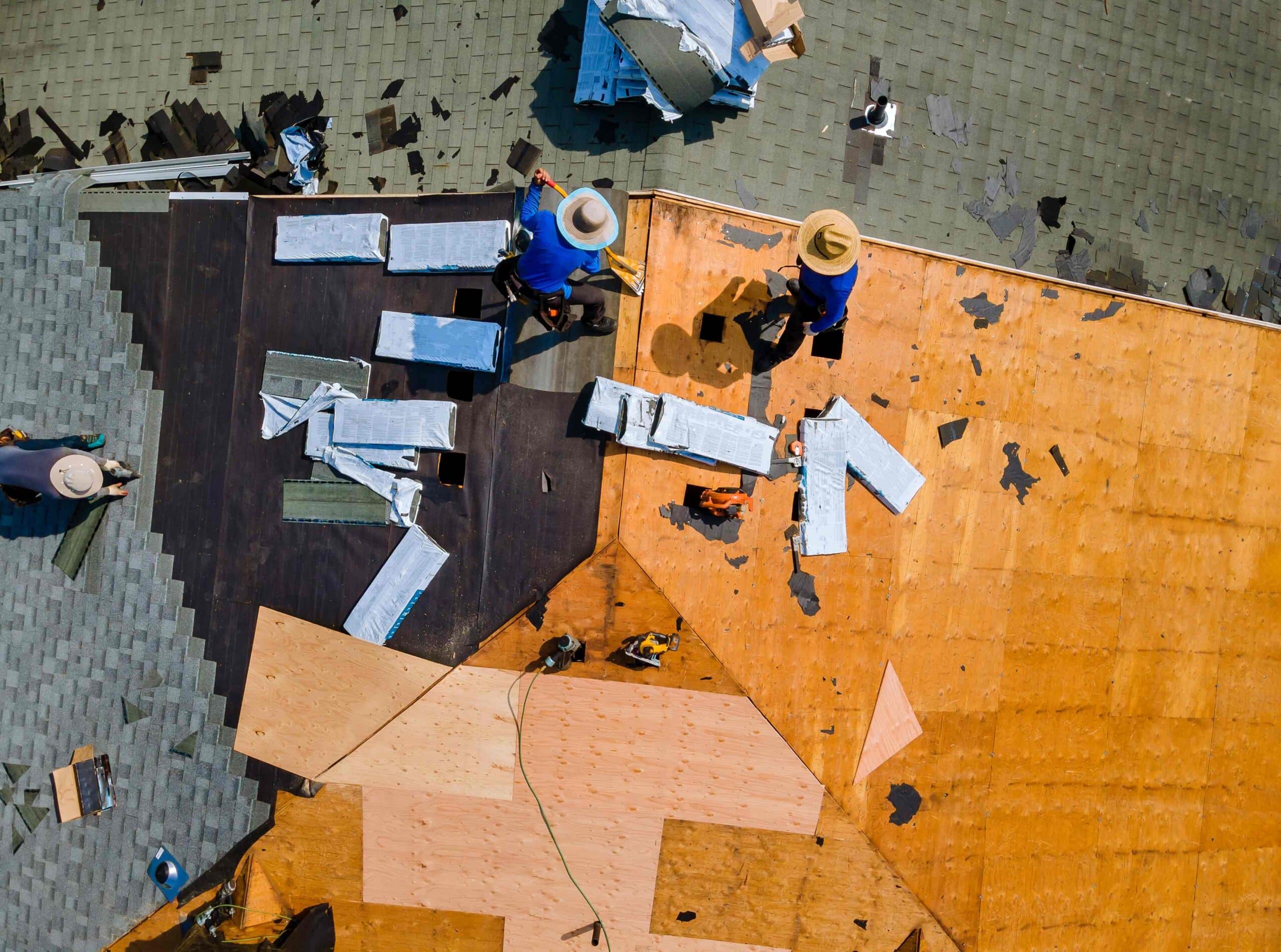 worker-hands-installing-bitumen-roof-shingles-with-2023-11-27-05-23-17-utc